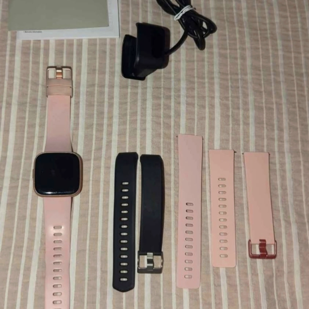 Fitbit Smartwatch with Pink and Black Bands